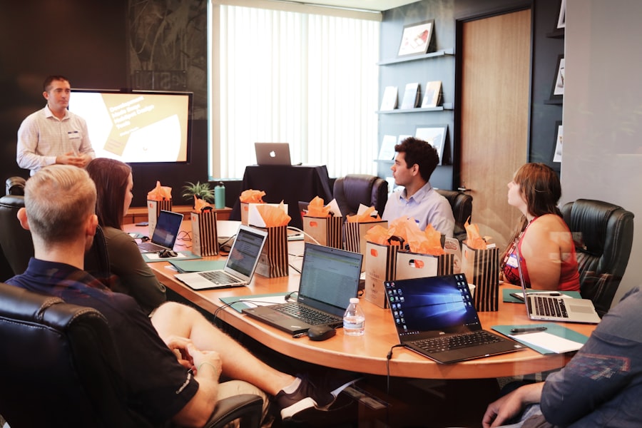 Marketing team meeting in a conference room reviewing a presentation