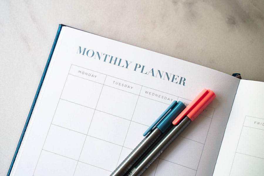 Monthly planner notebook with colored pens, representing content calendar planning