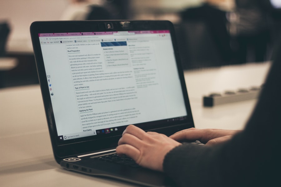 Person typing on a laptop with a blog article open, representing content marketing