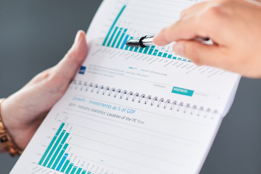 Person pointing a pen at a printed growth chart, representing business growth from SEO