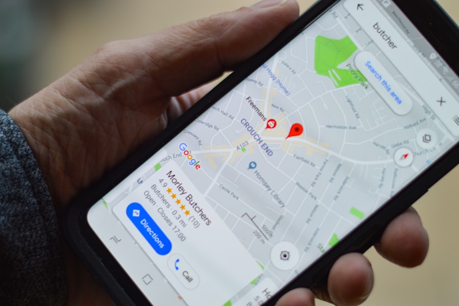 Hand holding a smartphone showing a Google Maps local business search result