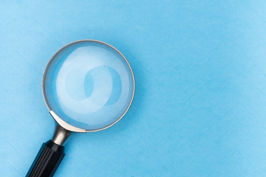 Magnifying glass resting on a desk, representing searching and keyword research